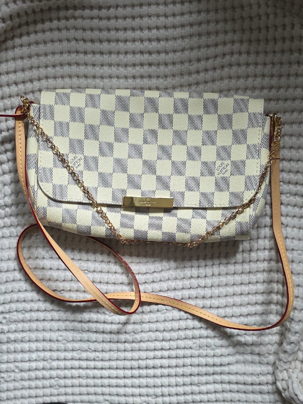 Louis Vuitton Favorite MM handbag in Damier Azur canvas with gold hardware.